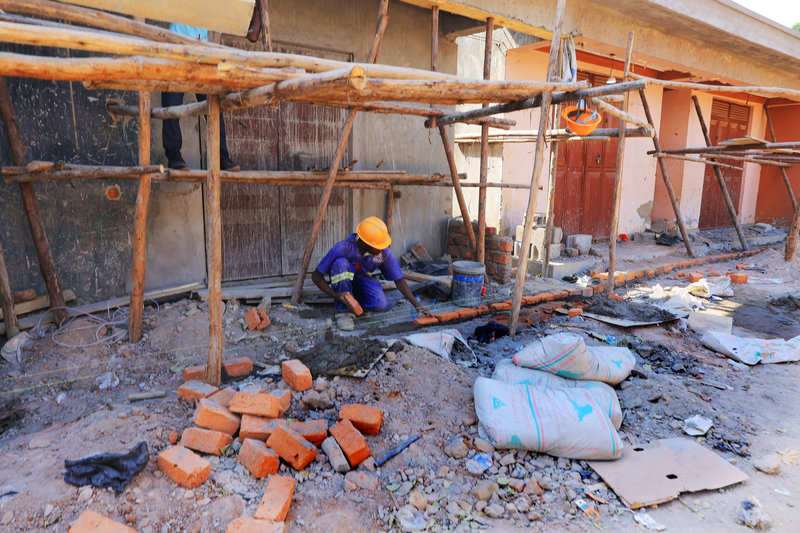 Workers mixing mortar